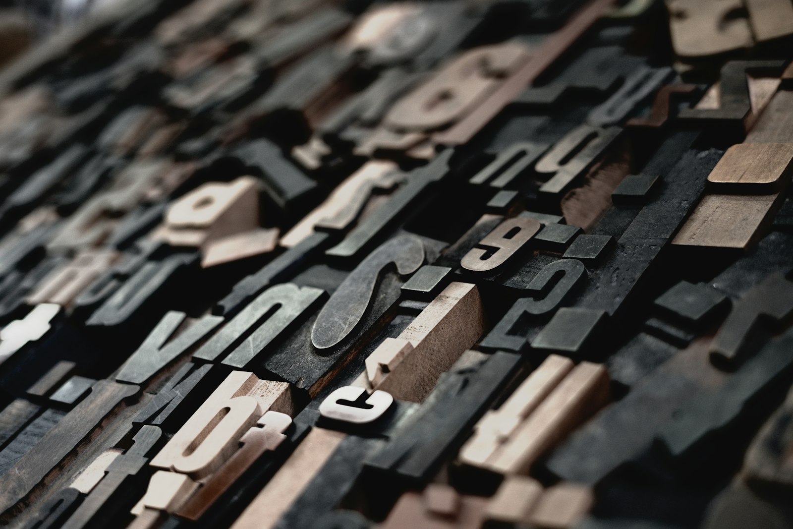 Rows of wooden letterpress type blocks in different typefaces, the raw material of choosing a font for a music video