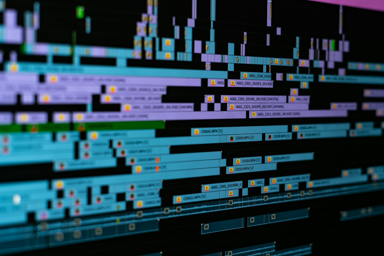 A video editing timeline crowded with dozens of stacked clip layers and effect labels, the kind of manual edit a lyric video template asks you to do
