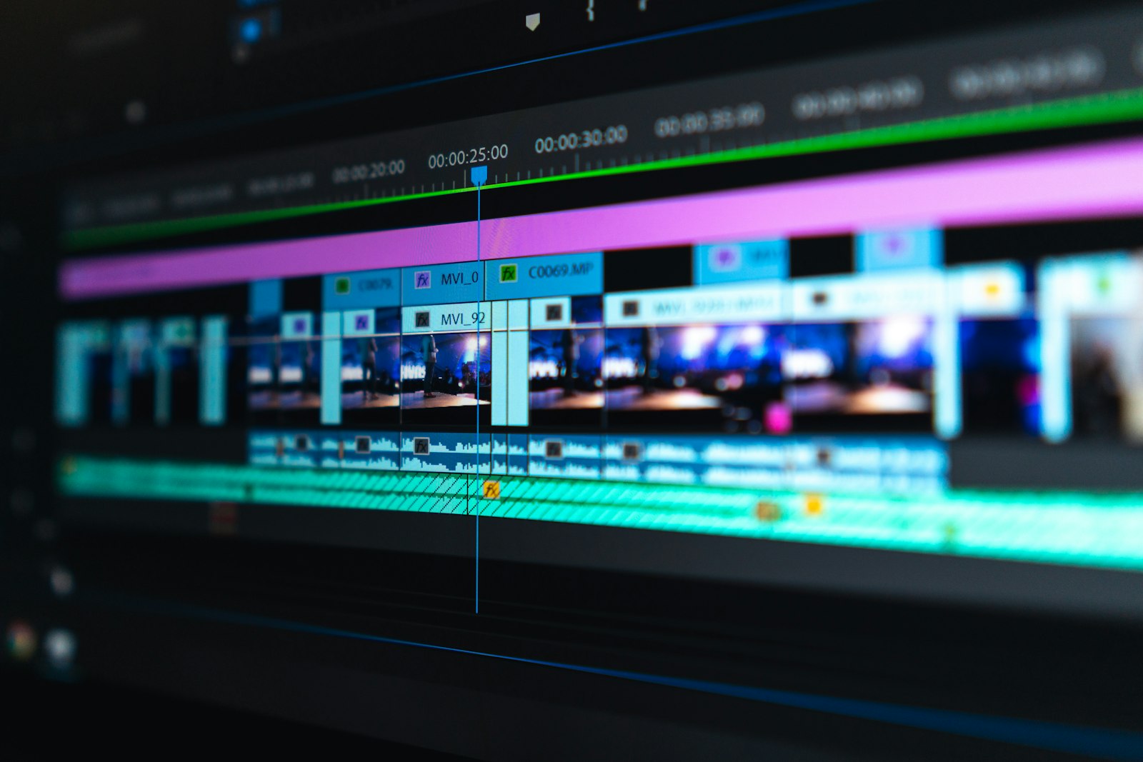 A video editing timeline open on a laptop screen, the point where a clip gets exported to a WebM or MP4 file before uploading